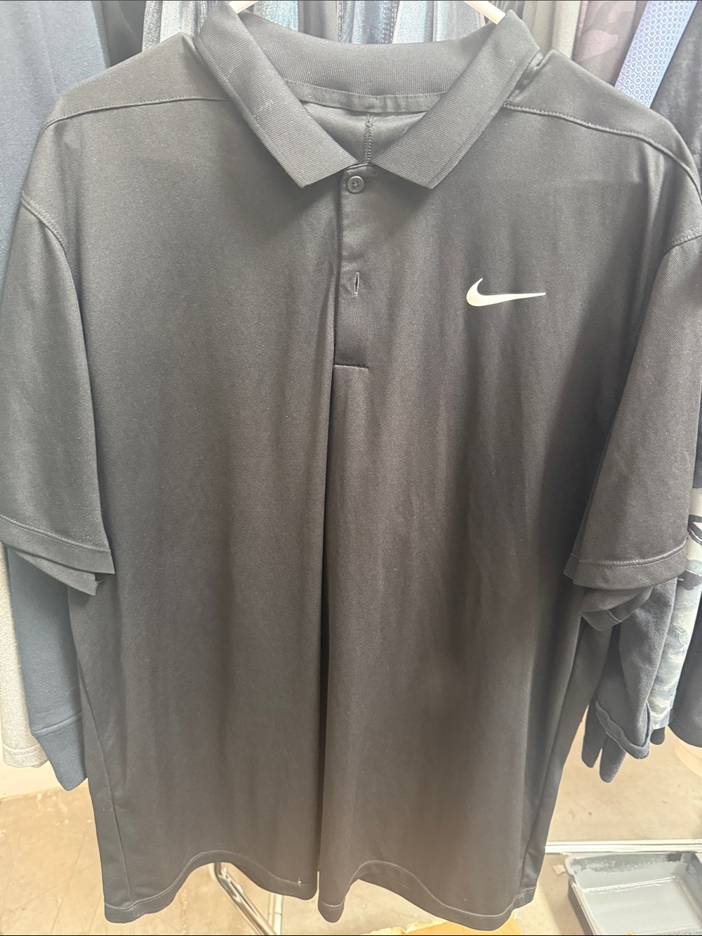 Nike Black Polo Shirt with White Swoosh